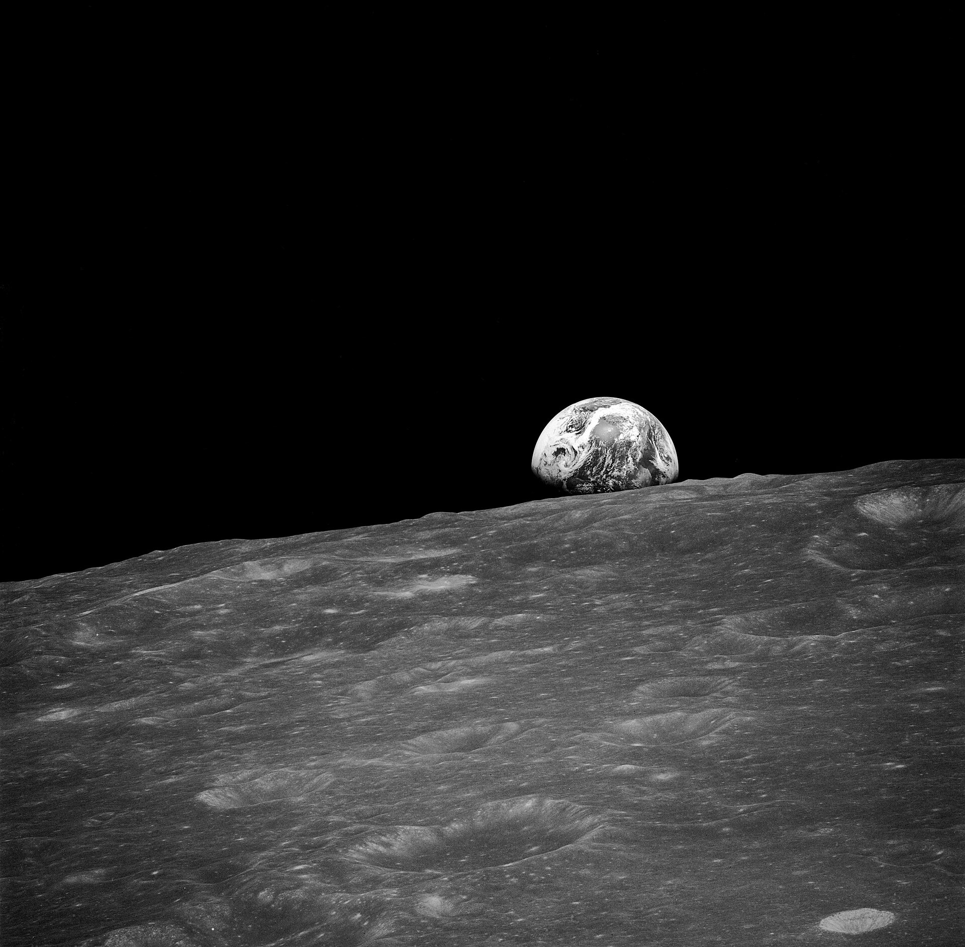 Earthrise: Earth seen above the Moon's horizon, photographed during the Apollo 8 mission in December 1968